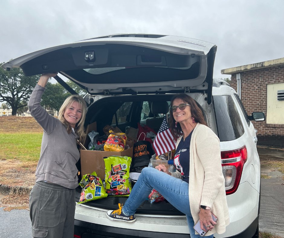 Suzy delivers an entire trunk full of leftover Halloween candy to  a Mom of  Blue Star Mothers of Coastal Carlolina II