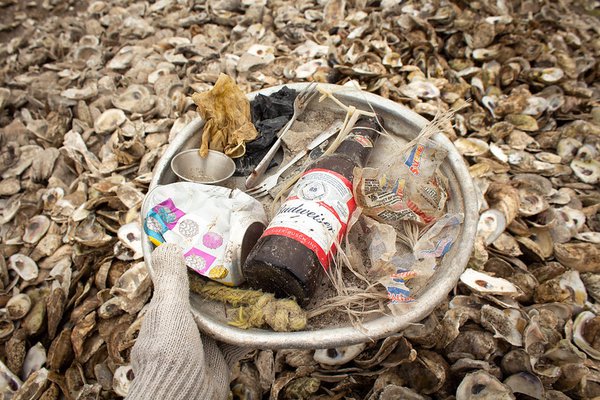Trash and recyclables separated from shells at an oyster recycling facility. SCDNR staff image.